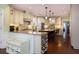 Bright kitchen with center island, wine rack and eat in breakfast area at 2050 Wappoo Hall Rd, Charleston, SC 29412