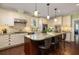 Bright kitchen boasts granite countertops, stainless steel appliances, and a large island with seating at 2050 Wappoo Hall Rd, Charleston, SC 29412