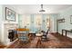 Cozy living room with fireplace, rocking chairs, and natural light at 2050 Wappoo Hall Rd, Charleston, SC 29412