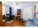 Comfortable home office space featuring hardwood floors, a ceiling fan and plenty of natural light at 2050 Wappoo Hall Rd, Charleston, SC 29412