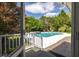 Inviting backyard pool with a patio, surrounded by lush trees, and is accessible from the house at 2050 Wappoo Hall Rd, Charleston, SC 29412