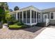 Inviting screened porch with white railings and steps, perfect for enjoying the outdoors at 2050 Wappoo Hall Rd, Charleston, SC 29412