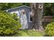 A classic shed sits alongside a mature tree, providing practical storage in a natural setting at 2050 Wappoo Hall Rd, Charleston, SC 29412