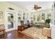 Bright sunroom with plenty of natural light and comfortable seating at 2050 Wappoo Hall Rd, Charleston, SC 29412