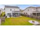 Well-maintained backyard with privacy fence, fire pit and screened-in porch at 209 Palmetto Walk Dr, Summerville, SC 29486