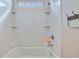 All white tub-shower combo with built-in shelves, shower head, and cute rubber ducky at 209 Palmetto Walk Dr, Summerville, SC 29486