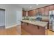 Well-lit kitchen showcasing a large island with granite countertop and modern appliances at 209 Palmetto Walk Dr, Summerville, SC 29486