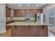 Modern kitchen featuring stainless steel appliances, granite counters, and wood cabinetry at 209 Palmetto Walk Dr, Summerville, SC 29486