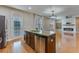 Kitchen island featuring stainless steel dishwasher and sink, connecting to the living room at 209 Palmetto Walk Dr, Summerville, SC 29486