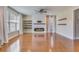 Living room featuring hardwood floors, a fireplace, and natural light from bright windows at 209 Palmetto Walk Dr, Summerville, SC 29486