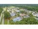 Aerial view of community amenities, including swimming pools and tennis courts, nestled among trees at 2225 Black Oak Court, Mount Pleasant, SC 29466