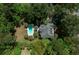 Aerial view of a house with a swimming pool in a wooded neighborhood at 2225 Black Oak Court, Mount Pleasant, SC 29466