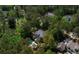 Aerial view of a home with a private pool, nestled among mature trees and lush landscaping at 2225 Black Oak Court, Mount Pleasant, SC 29466