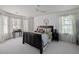 Bright bedroom features a ceiling fan, two windows, carpet and neutral colored walls at 2225 Black Oak Court, Mount Pleasant, SC 29466