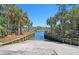 View of boat ramp to the waterway, surrounded by lush landscaping and mature palm trees at 2225 Black Oak Court, Mount Pleasant, SC 29466