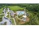 Overhead view of a resort-style pool with slide, umbrellas, and other amenities in a lush setting at 2225 Black Oak Court, Mount Pleasant, SC 29466
