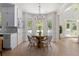 Cozy dining area with a glass-topped table, stylish chairs, and view of outdoor scenery at 2225 Black Oak Court, Mount Pleasant, SC 29466