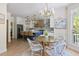 Charming dining area adjacent to the kitchen with stylish chairs and a modern chandelier at 2225 Black Oak Court, Mount Pleasant, SC 29466