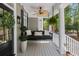 Inviting front porch featuring a swing, fan, and stylish decorations at 2225 Black Oak Court, Mount Pleasant, SC 29466