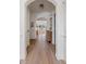 Hallway with hardwood floors, arched doorways, and stylish decor at 2225 Black Oak Court, Mount Pleasant, SC 29466