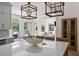 Bright kitchen featuring an island with a white countertop and open floor plan to the living area at 2225 Black Oak Court, Mount Pleasant, SC 29466