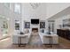 Bright living room boasting high ceilings, a fireplace, custom built-ins, and plenty of natural light at 2225 Black Oak Court, Mount Pleasant, SC 29466