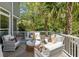 Cozy outdoor patio featuring comfortable wicker furniture, stylish cushions, and lush landscaping for privacy at 2225 Black Oak Court, Mount Pleasant, SC 29466