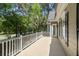 Covered porch overlooking backyard with lush landscaping and natural light at 2225 Black Oak Court, Mount Pleasant, SC 29466