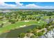 Expansive aerial view of the community golf course, showcasing lush green fairways and scenic water features at 225 Delahow St, Daniel Island, SC 29492