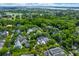 Expansive aerial shot of a residential area, showcasing lush green trees and diverse rooftops at 225 Delahow St, Daniel Island, SC 29492