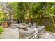 Outdoor space with patio, fire pit, string lights and ample seating at 225 Delahow St, Daniel Island, SC 29492