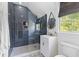 Stylish bathroom with a frameless shower, new vanity, and patterned tile floors at 225 Delahow St, Daniel Island, SC 29492