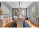 Elegant dining room with hardwood floors, wainscoting, and chandelier at 225 Delahow St, Daniel Island, SC 29492