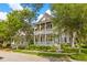 Beautiful two-story home featuring double porches and landscaping at 225 Delahow St, Daniel Island, SC 29492