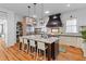 Well-lit kitchen features a large island, stainless steel appliances, and ample storage at 225 Delahow St, Daniel Island, SC 29492