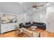 Bright living space with neutral paint, light wood floors, and comfortable seating at 225 Delahow St, Daniel Island, SC 29492