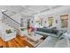 Open concept living room with staircase, coffered ceilings, and hardwood floors at 225 Delahow St, Daniel Island, SC 29492