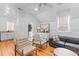Bright living space with neutral paint, light wood floors, and comfortable seating at 225 Delahow St, Daniel Island, SC 29492