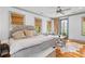 Spacious bedroom with stylish decor, hardwood floors, and a cozy seating area at 225 Delahow St, Daniel Island, SC 29492