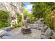 Inviting outdoor patio with comfortable seating, fire pit, and grill, perfect for entertaining at 225 Delahow St, Daniel Island, SC 29492