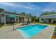 Inviting backyard pool area with comfortable seating and a screened-in porch, perfect for outdoor enjoyment at 229 Twin Lake Dr, Summerville, SC 29483