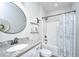 Bathroom with vanity featuring granite countertops, round mirror, and shower and tub combo with curtain at 229 Twin Lake Dr, Summerville, SC 29483