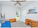 Bright bedroom with light gray walls featuring a daybed, desk, and a window overlooking a green lawn at 229 Twin Lake Dr, Summerville, SC 29483