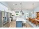Spacious kitchen and dining area with stainless appliances, white cabinetry, and an adjacent wooden dining set at 229 Twin Lake Dr, Summerville, SC 29483