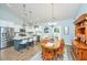 Bright kitchen and dining area with white cabinets, stainless appliances and a cozy wooden dining set at 229 Twin Lake Dr, Summerville, SC 29483