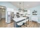 Well-lit kitchen with white cabinetry, stainless steel appliances, subway tile backsplash and stylish pendant lighting at 229 Twin Lake Dr, Summerville, SC 29483