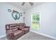 Living room with gray walls, featuring a leather recliner and a window with natural light at 229 Twin Lake Dr, Summerville, SC 29483