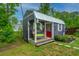Quaint outbuilding featuring a cozy porch and charming details, providing a delightful retreat on the property at 229 Twin Lake Dr, Summerville, SC 29483