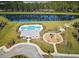 Aerial view of property with a pool, playground, and pond at 234 Basket Grass Ln, Summerville, SC 29486