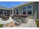 Backyard featuring a hot tub, patio, and a rock garden at 234 Basket Grass Ln, Summerville, SC 29486